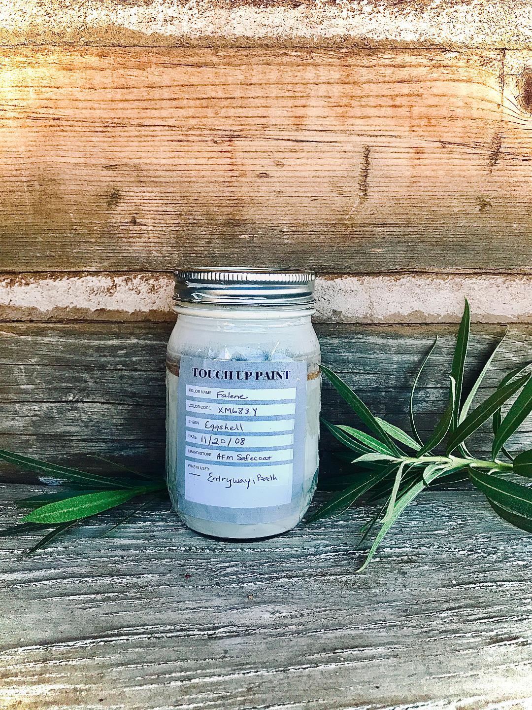 canning jar with a label sitting outside in a natural looking setting