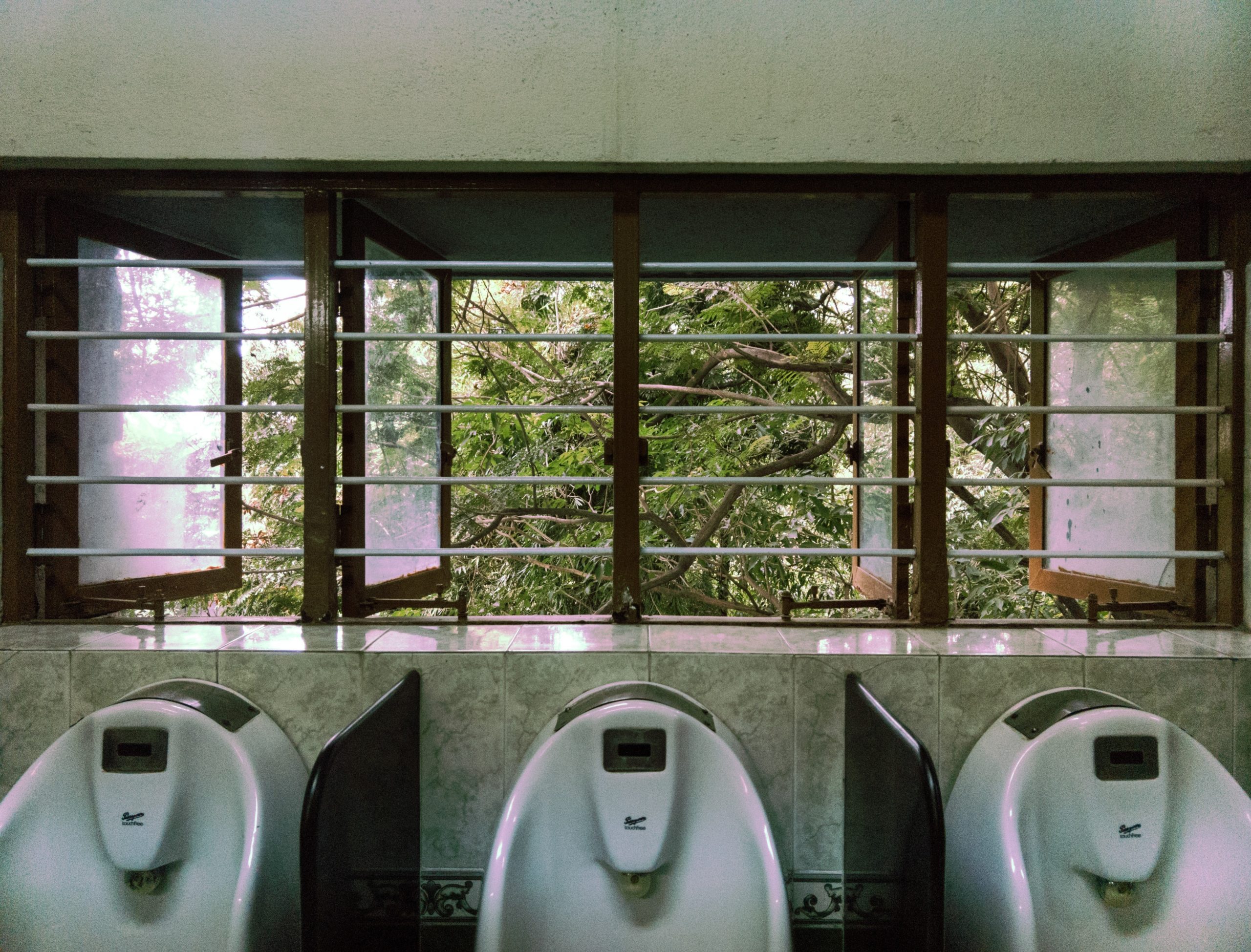 clean-urinals-beneath-beatiful-window-for-a-better-cleaning-solution