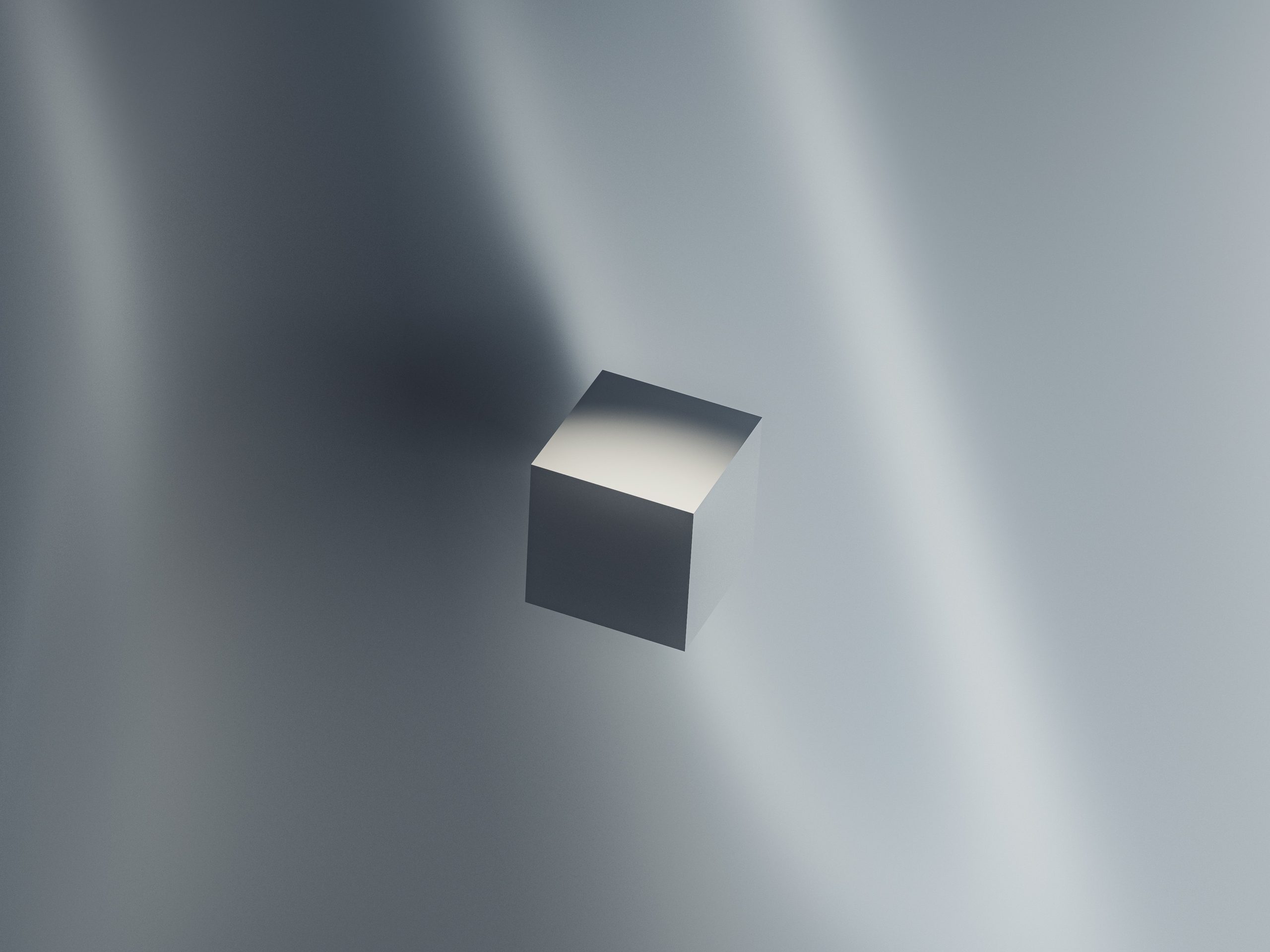 grey cube floating in a grey background